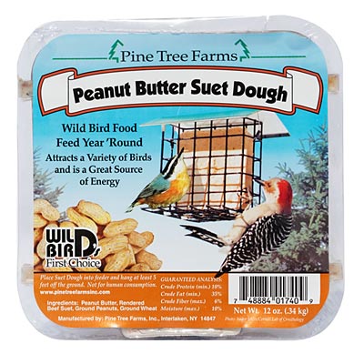 Clear plastic-wrapped square suet cake labeled “Peanut Butter Suet Dough,” featuring colorful birds enjoying a suet feeder. The cake is infused with real peanuts and peanut butter, offering a rich, high-energy treat perfect for year-round feeding.